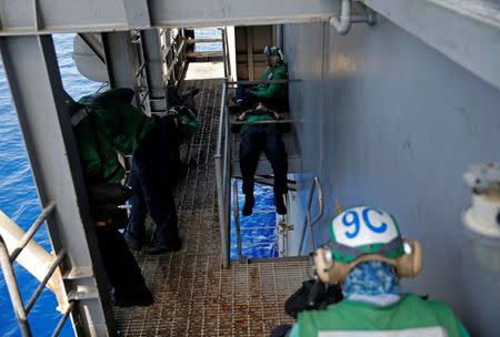 US Navy sailors rest on the USS Harry S. Truman aircraft carrier in the eastern Mediterranean Sea June 13, 2016. REUTERS/Baz Ratner