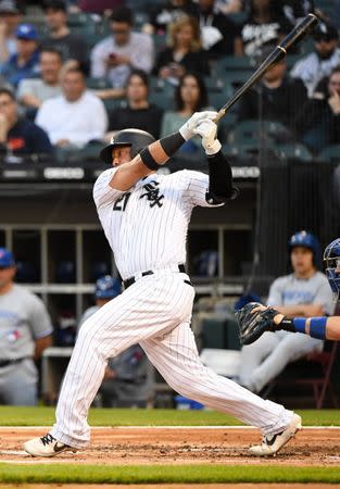 FILE PHOTO: May 16, 2019; Chicago, IL, USA; Chicago White Sox catcher Welington Castillo (21) hits a RBI single against the Toronto Blue Jays during the first inning at Guaranteed Rate Field. Mandatory Credit: Mike DiNovo-USA TODAY Sports