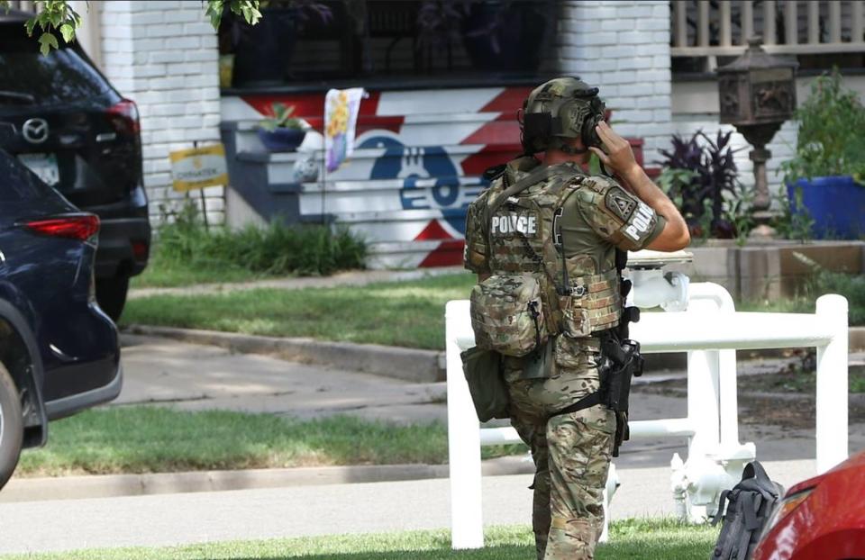 In 2023, Wichita had a record number of killings that had a tie to domestic violence. Here, a SWAT officer responds to a call of an armed man who was the estranged husband of a woman found killed in Riverside.