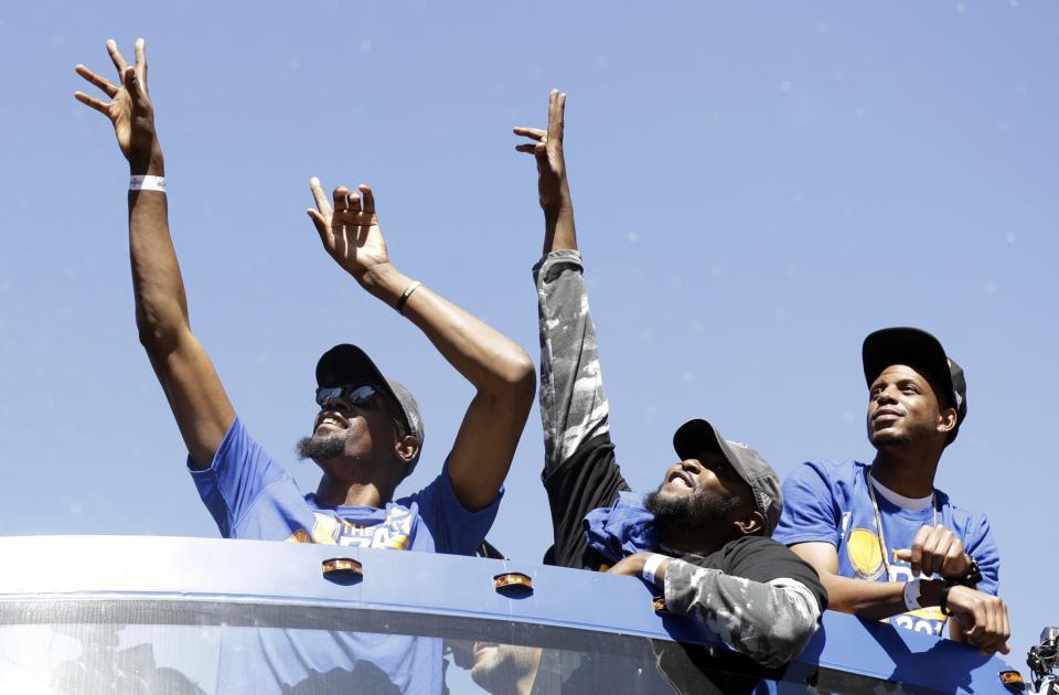 <p>Golden State Warriors’ Kevin Durant, top left, during a parade and rally after winning the NBA basketball championship Thursday, June 15, 2017, in Oakland, Calif. (AP Photo/Marcio Jose Sanchez) </p>