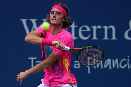 Aug 14, 2018; Mason, OH, USA; Stefanos Tsitsipas (GRE) returns a shot against David Goffin (BEL) in the Western and Southern tennis open at Lindner Family Tennis Center. Aaron Doster-USA TODAY Sports