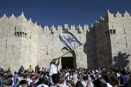 Israelis dance near Damascus Gate outside Jerusalem's Old City during a march marking Jerusalem Day in this May 17, 2015 file photo. REUTERS/Baz Ratner/Files