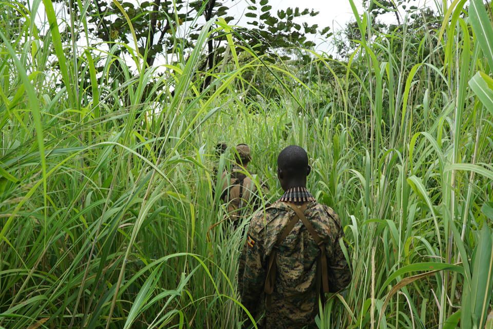 A Ugandan soldier accompanies U.S. Special Forces on foot patrol in Haute-Kotto Prefecture, Central African Republic, Sept. 15, 2016. The soldiers were part of an operation attempting to find the warlord Joseph Kony.