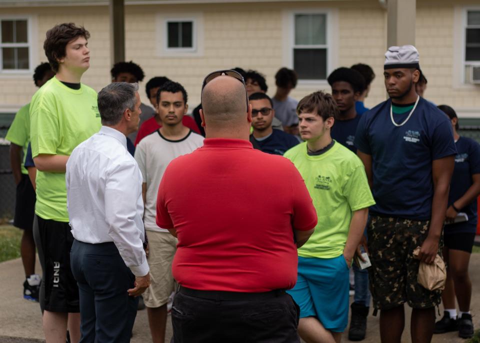 The volunteers get a pep talk before the launch of Greater Fall River RE-Creation's free summer lunch program.