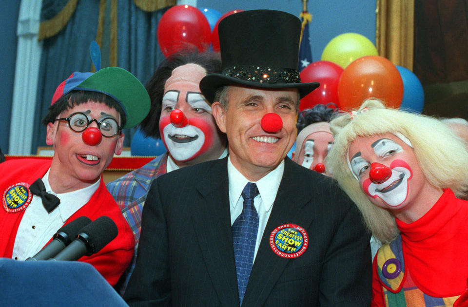<p>New York City Mayor Rudolph W. Giuliani, center, doffed with a red clown nose and ringmaster’s top hat, is joined by Ringling Brothers Barnum and Bailey Circus clowns Chris Allison, left, and Karen DeSanto, right, at City Hall Tuesday, Feb. 23, 1999, in New York. (AP Photo/Marty Lederhandler) </p>