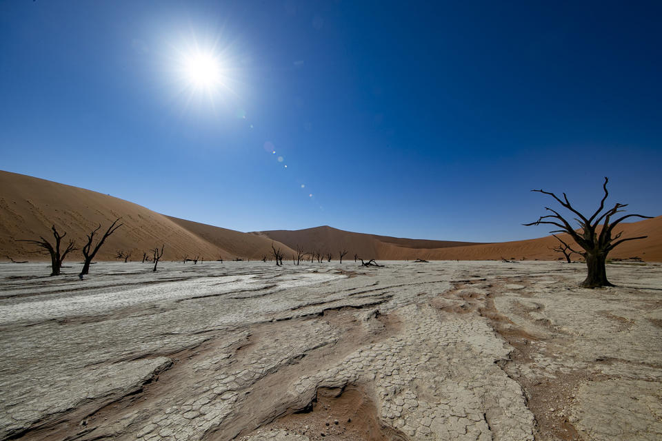 The morning sun starts to heat up the clay and salt pan at Deadvlei in the southern part of the Namib Desert, in the Namib-Naukluft National Park of Namibia. (Photo: Gordon Donovan/Yahoo News)