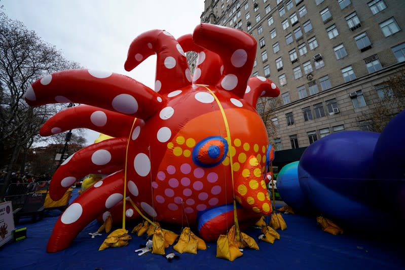 The Macy's Thanksgiving Day Parade Love Flies Up to the Sky by Yayoi Kusama balloon sits inflated in New York