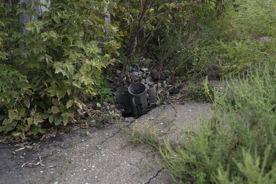 A part of a rocket sits wedged in the ground in an area at the Veres farm in Novomykolaivka, eastern Ukraine, Saturday, Sept. 10, 2022. All work has halted on this large eastern Ukrainian farm, whose fields and compound have been hit so many times by mortars, rockets, missiles and cluster bombs that its workers are unable to sow the crater-scarred land or harvest any crops. (AP Photo/Leo Correa)