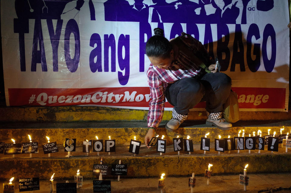 <p>A Filipino activist places candles for the victims of extrajudicial killings during a demonstration at the Sto. Domingo Church in Quezon City, east of Manila, Philippines on Wednesday, 31 August 2016. (Richard James Mendoza/NurPhoto via Getty Images) </p>