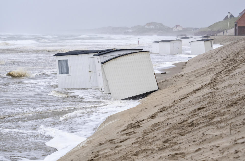 Picnic cabins get flooded in the water of the North Sea in the strong winds in Loekken, Denmark, Tuesday, Aug. 8, 2023. (Henning Bagger/Ritzau Scanpix via AP)