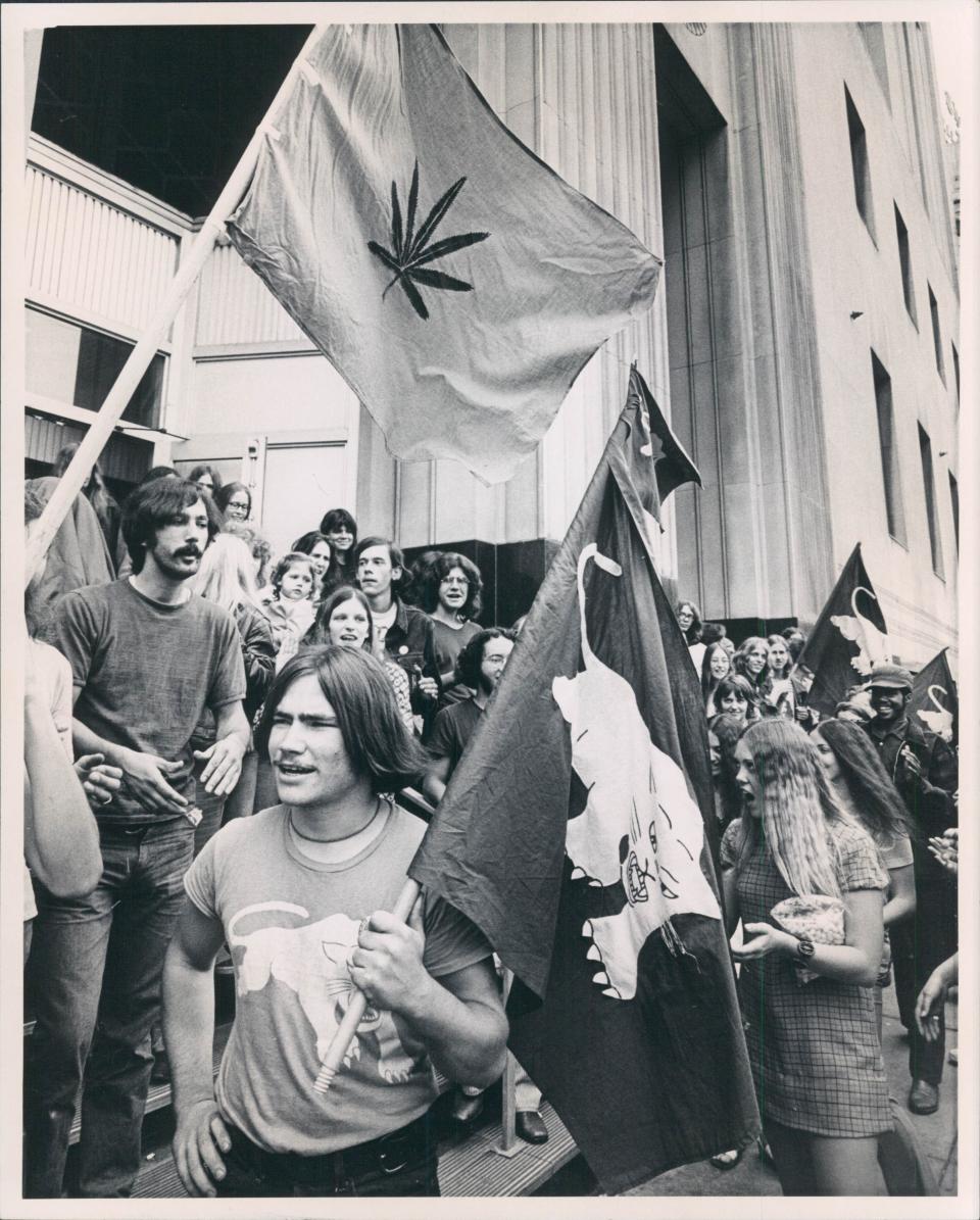 Flags carried by White Panthers outside Federal Building during hearing for John Sinclair and Pun Plamondon and two other White Panthers in connection with conspiring to bomb a CIA recruiting office in Ann Arbor.