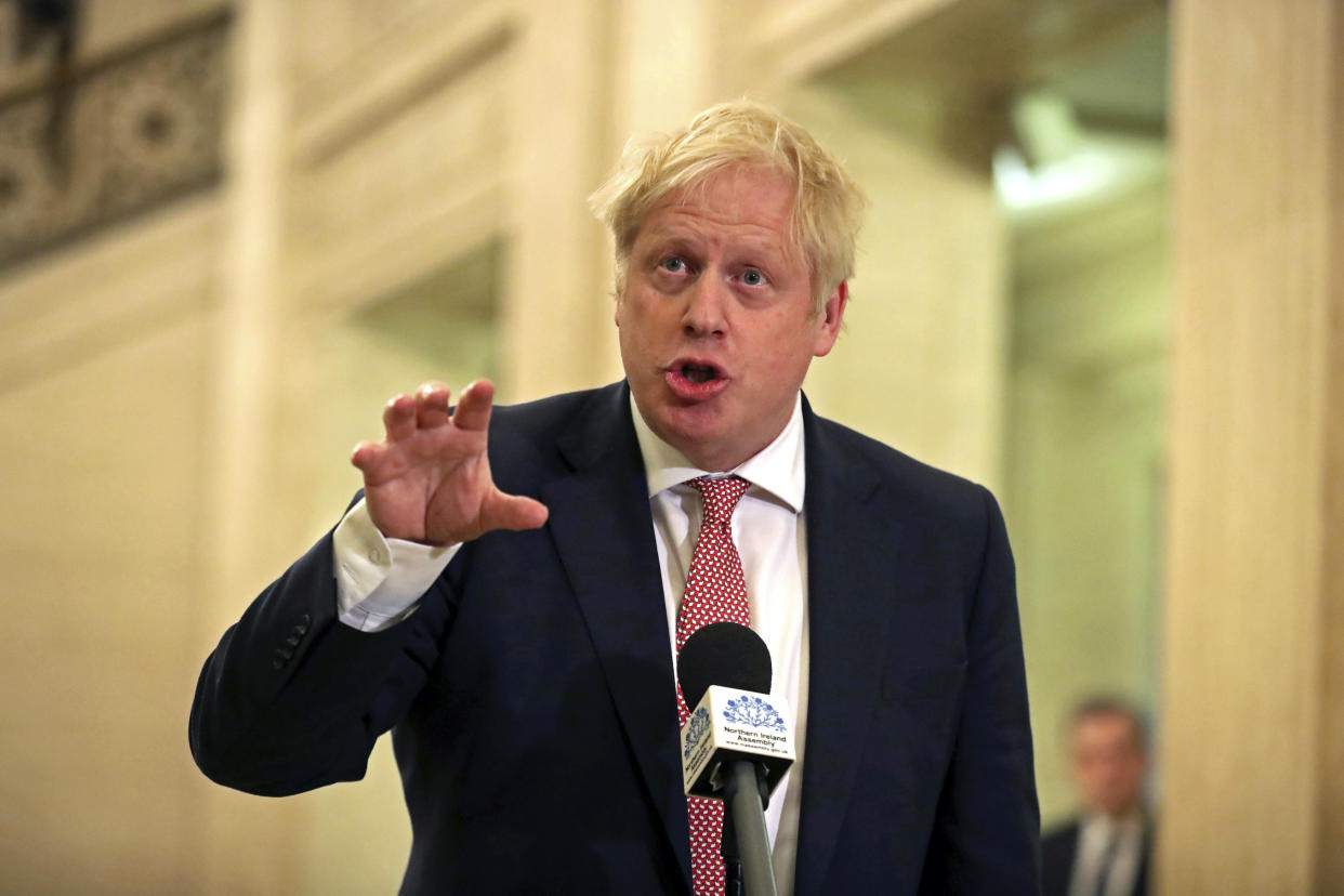 Britain's Prime Minister Boris Johnson, speaks in the Parliament Buildings at Stormont, Belfast, Northern Ireland, Monday Jan. 13, 2020, as the power sharing  Northern Ireland assembly starts up. (Liam McBurney/PA via AP)