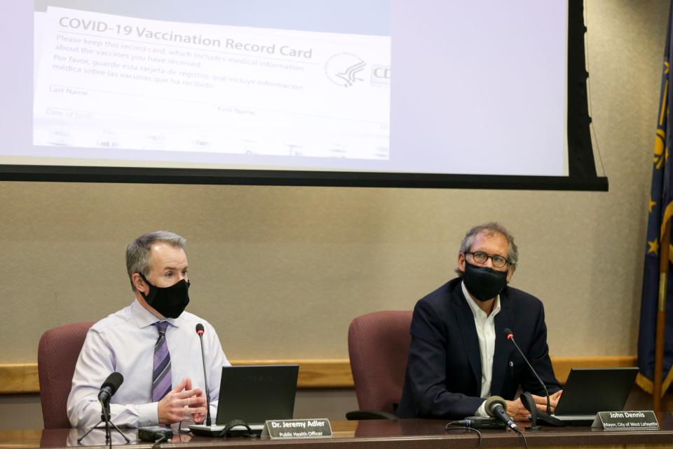 Dr. Jeremy Adler, Tippecanoe County’s health officer, left, speaks during a press conference at the Tippecanoe County Office Building, Wednesday, Dec. 8, 2021 in Lafayette.