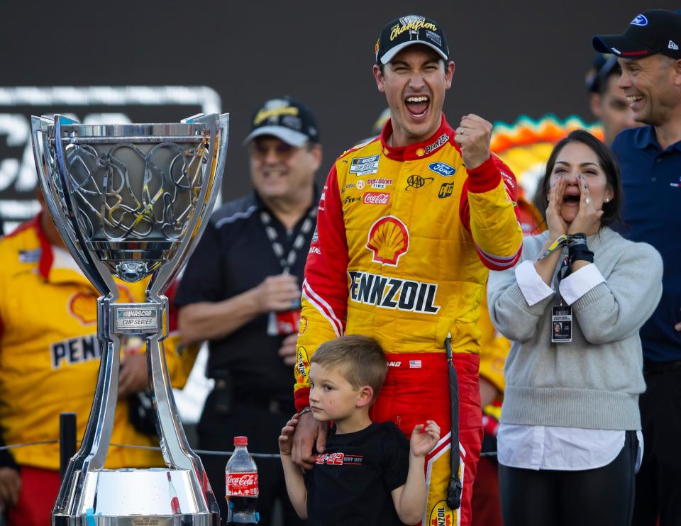 Joey Logano celebrates after winning the 2022 NACAR Cup Series Championship at Phoenix Raceway.