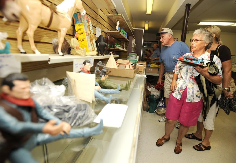 Shoppers browse antique toys during a liquidation sale at the Marx Toys Museum in June 2008.