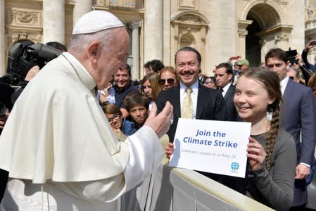 FILE PHOTO: Climate activist Swedish teenager Greta Thunberg meets Pope Francis during the weekly audience at Saint Peter's Square at the Vatican