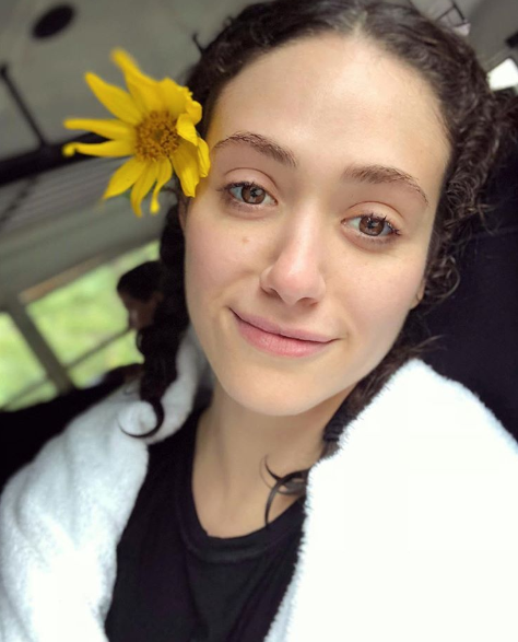 <p>The 31-year-old shares a post-rafting selfie, and we can’t believe how angelic she looks. With her hair pulled back and adorned by a sunflower, she brings the focus to her big brown eyes. (Photo: Instagram/EmmyRossum) </p>