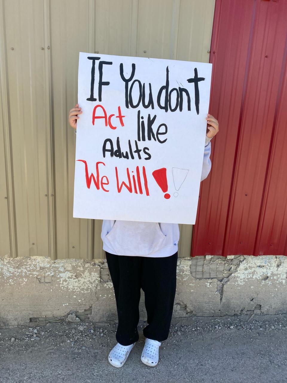 A student at Ministik community school in Cumberland House Cree nation protesting. 