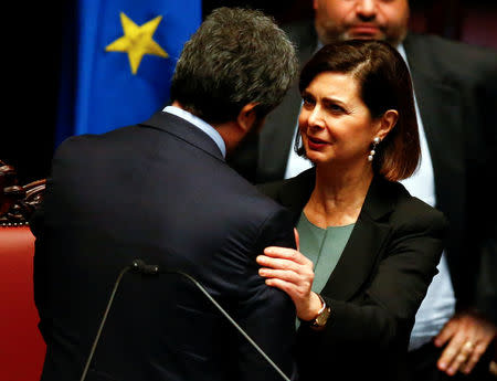 Former president Laura Boldrini talks to the new Chamber of Deputies president, Five Stars Movement (M5S) Roberto Fico at the Chamber of Deputies during the second session day since the March 4 national election in Rome, Italy March 24, 2018. REUTERS/Tony Gentile