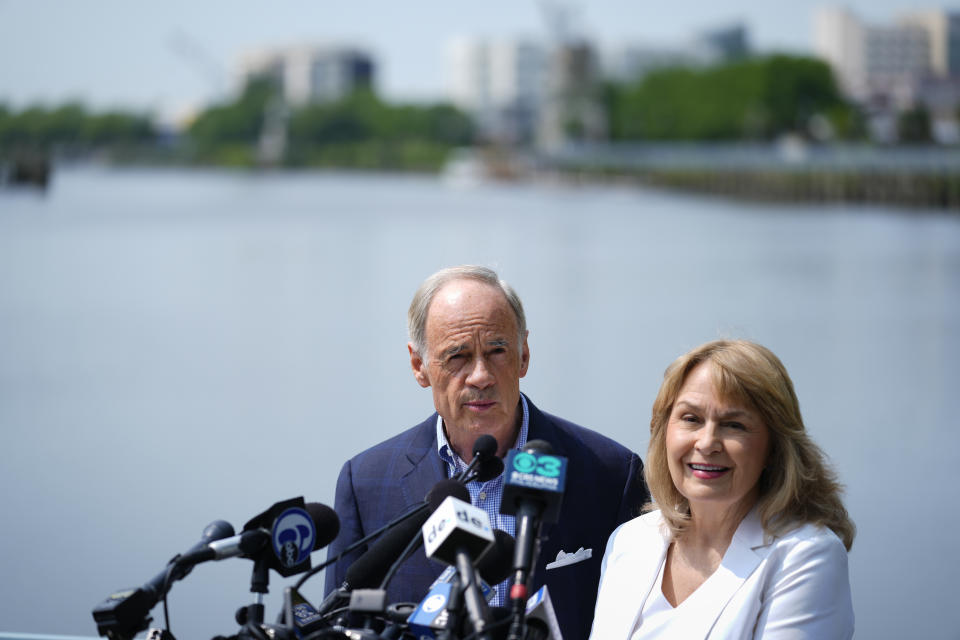 Sen. Tom Carper, D-Del., accompanied by his wife Martha, speaks during a news conference in Wilmington, Del., Monday, May 22, 2023. Carper announced Monday that he will not seek re-election to a fifth term in the U.S. Senate. (AP Photo/Matt Rourke)