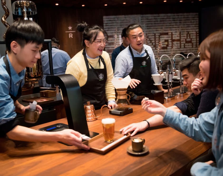 A group of employees at the Starbucks Roastery in Shanghai.