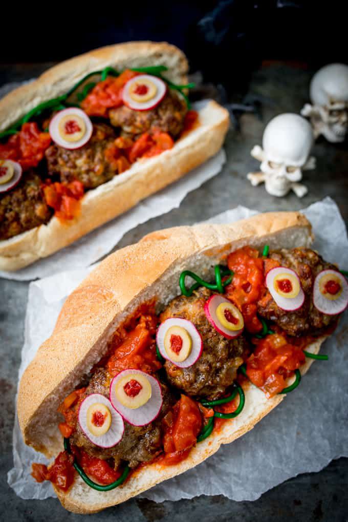 <p>Packed with juicy meatballs and a thick tomato sauce base, these Halloween eyeball subs are scarily delicious. </p><p><strong>Get the recipe at <a rel="nofollow noopener" href="https://www.kitchensanctuary.com/halloween-eyeball-sub/" target="_blank" data-ylk="slk:Kitchen Sanctuary." class="link rapid-noclick-resp">Kitchen Sanctuary. </a></strong></p>