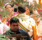 Vidya's father takes Sidharth through the rituals.