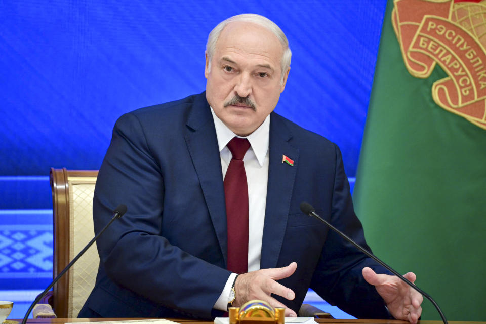 Belarusian President Alexander Lukashenko gestures while speaking during an annual press conference in Minsk, Belarus, Monday, Aug. 9, 2021. Belarus' authoritarian leader on Monday charged that the opposition was plotting a coup in the runup to last year's presidential election that triggered a monthslong wave of mass protests. President Alexander Lukashenko held his annual press conference on Monday, the one-year anniversary of the vote that handed him a sixth term in office but was denounced by the opposition and the West as rigged. (Andrei Stasevich/BelTA photo via AP)
