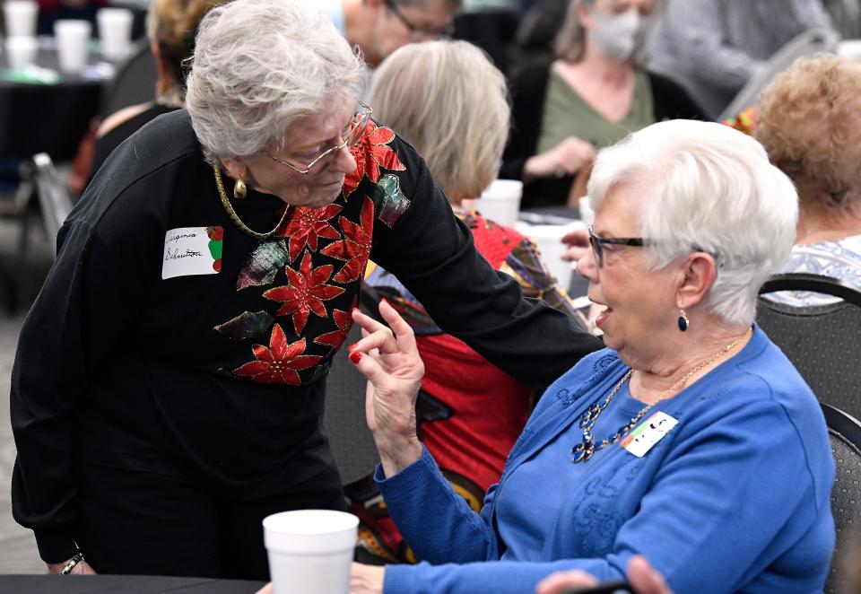 Former teachers Virginia Schmittou (left) and Sue Siltman catch up with each other at Thursday's luncheon for AISD retirees at the Abilene Convention Center. This luncheon returned after last year's hiatus due to the pandemic.