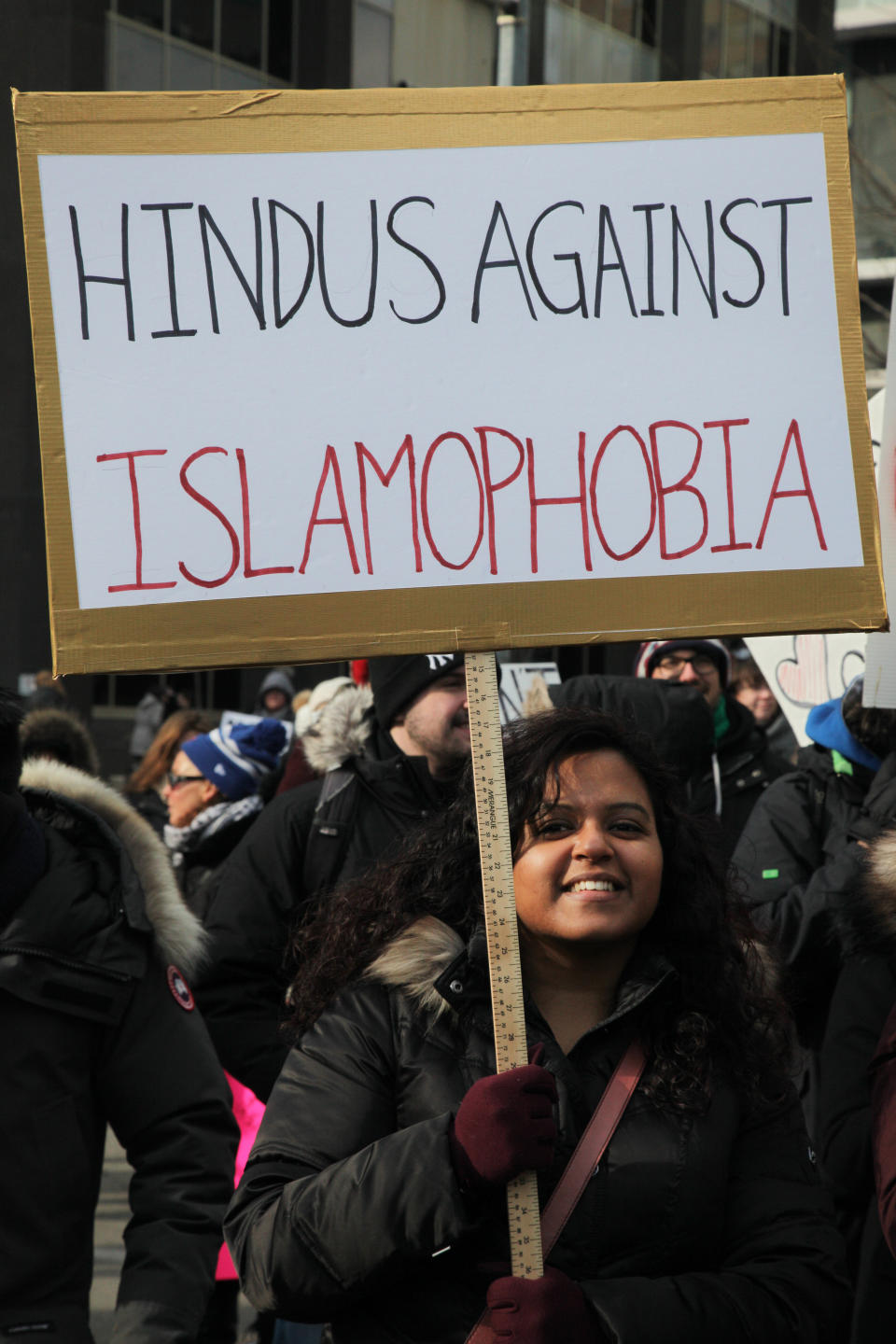 Hindu woman holds a sign saying 'Hindus Against Islamophobia' as thousands of Canadians take part in a massive protest against President Trump's travel ban on Muslims during the National Day of Action against Islamophobia and White Supremacy in downtown Toronto, Ontario, Canada, on February 04, 2017.&nbsp;