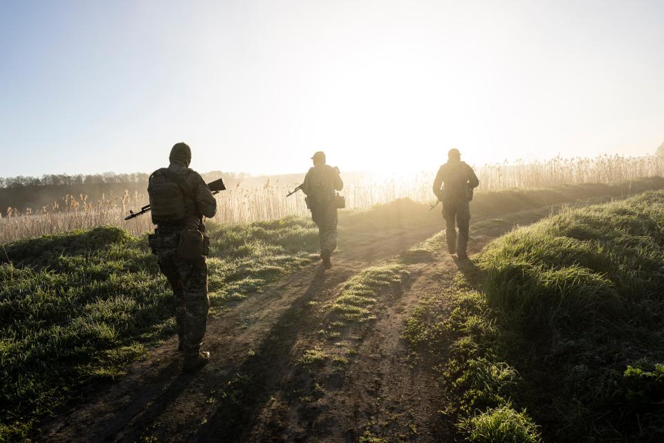 Ukrainian Border Guard soldiers participate in a military exercise in central Ukraine, Tuesday, May 2, 2023. Ahead of the much-anticipated Ukrainian counter-offensive, newly formed military assault units train in the country's dense forests.