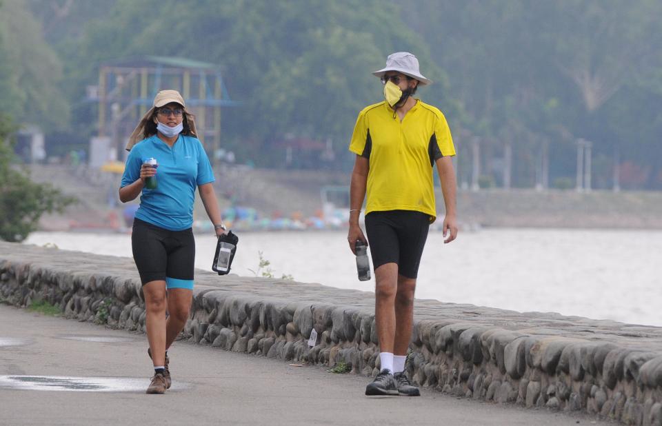 CHANDIGARH, INDIA - JUNE 7: A couple out on a morning walk at Sukhna Lake, on June 7, 2020 in Chandigarh, India. (Photo by Keshav Singh/Hindustan Times via Getty Images)