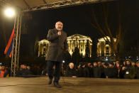 Opposition leader Vazgen Manukyan speaks to a crowd during a rally to pressure Armenian Prime Minister Nikol Pashinyan to resign in Yerevan, Armenia, Monday, March 1, 2021. Amid escalating political tensions in Armenia, supporters of the country's embattled prime minister and the opposition are staging massive rival rallies in the capital of Yerevan. Prime Minister Nikol Pashinyan has faced opposition demands to resign since he signed a peace deal in November that ended six weeks of intense fighting with Azerbaijan over the Nagorno-Karabakh region. (Lusi Sargsyan/PHOTOLURE via AP)