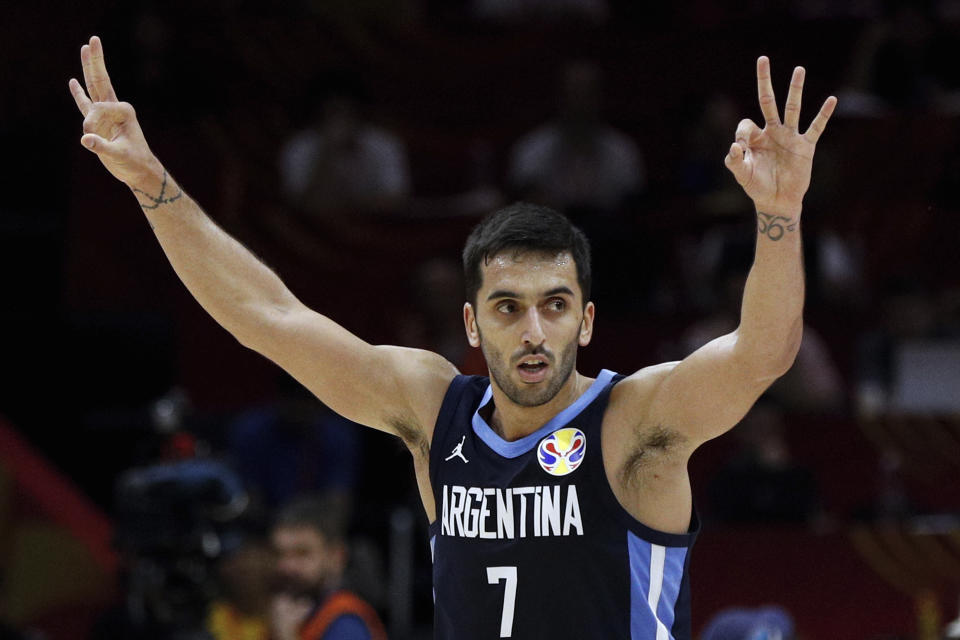 FILE - In this Sept. 4, 2019, file photo, Facundo Campazzo of Argentina celebrates after a teammate's 3-pointer against Russia during their Group B match in the FIBA Basketball World Cup at the Wuhan Sport Center in Wuhan in central China's Hubei province. Campazzo agreed to a two-year deal with the Denver Nuggets on Friday, Nov. 20, 2020, the opening day of free agency, according to a person with direct knowledge of the deal. The person spoke to The Associated Press on condition of anonymity because the contract remains unfinished until at least Sunday, when the NBA moratorium on new signings will be lifted. (AP Photo/Andy Wong, File)