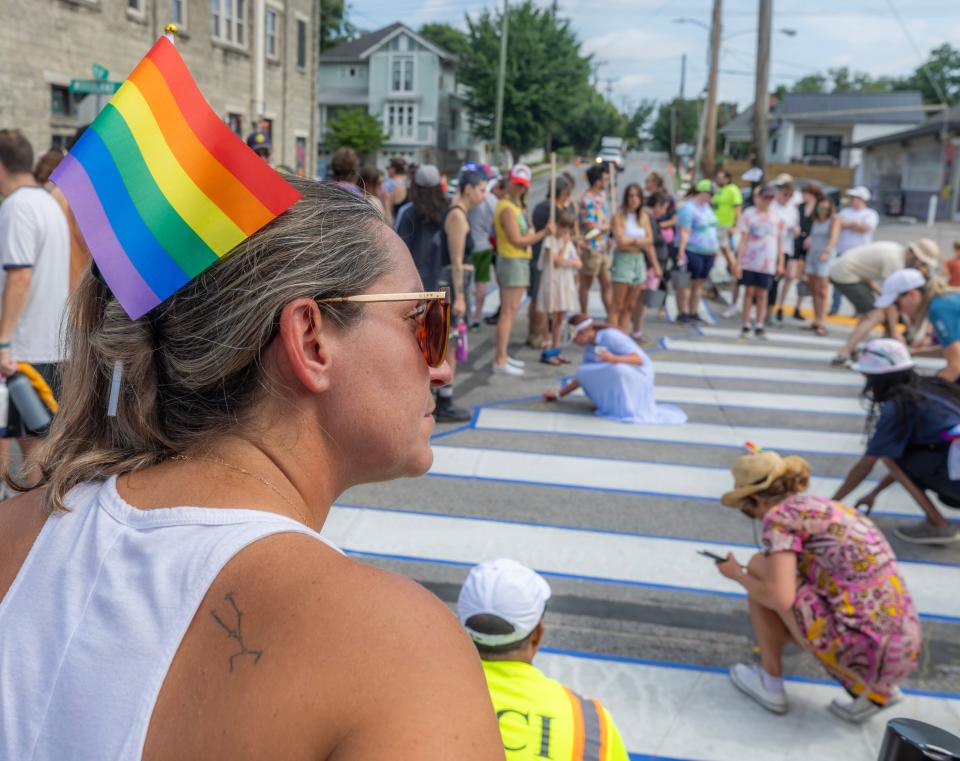 Katie Struzick looks on during a painting party held to create Nashville’s first rainbow crosswalk in the intersection of 14th St. and Woodland St. Saturday, June 29, 2024.