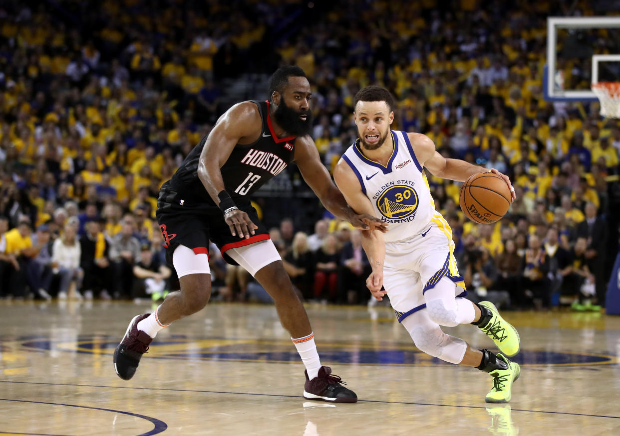 OAKLAND, CALIFORNIA - MAY 08:   Stephen Curry #30 of the Golden State Warriors dribbles past James Harden #13 of the Houston Rockets during Game Five of the Western Conference Semifinals of the 2019 NBA Playoffs at ORACLE Arena on May 08, 2019 in Oakland, California.  NOTE TO USER: User expressly acknowledges and agrees that, by downloading and or using this photograph, User is consenting to the terms and conditions of the Getty Images License Agreement.  (Photo by Ezra Shaw/Getty Images)