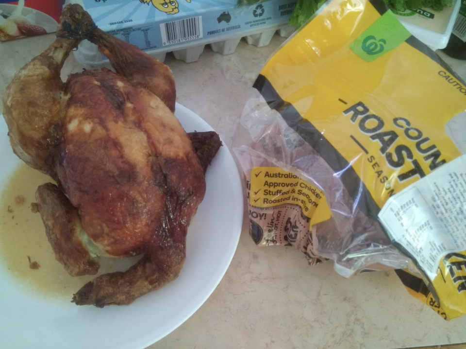 Photo shows Woolworths roast chicken with a neck attached. 