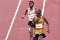 <p>Team Uganda's Joshua Cheptegei reacts to winning the gold medal during the Men's 5000m Final. </p>
