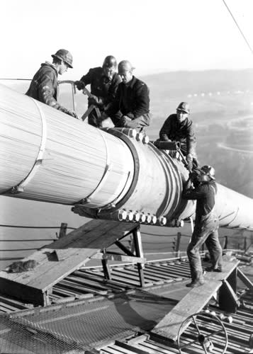 Workers on the main cable of the Golden Gate Bridge. From the holdings of the Golden Gate Bridge, Highway and Transportation District, Used with Permission, www.goldengate.org