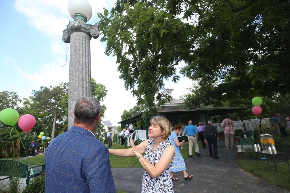 Mike Fitzpatrick, president of Elford Inc., and Kristin Greenberg, executive director of the Upper Arlington Historical Society, talk about repairing this light at First Community Village, which was one of the original street lights in Upper Arlington. The light would have been part of Upper Arlington's streets around 1915.