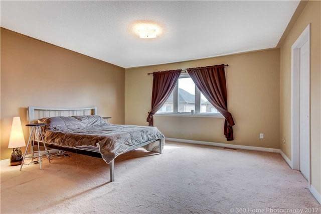 <p><span>33 Starhill Cres., Markham, Ont.</span><br>There are three bedrooms on the upper level and another in the finished basement.<br>(Photo: Zoocasa) </p>