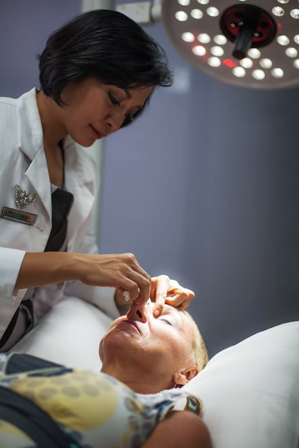 Treat you right: Dr. Danu treats one of her patients. Cocoon Medical Spa is now a popular place for beauty buffs. (