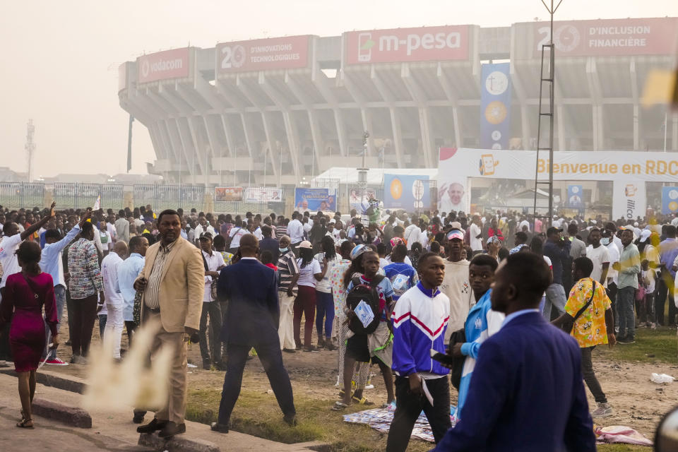 Faithful arrive at the Martyrs' Stadium in Kinshasa, Democratic Republic of Congo for a meeting between Francis and young people, Thursday, Feb. 2, 2023. Francis is in Congo and South Sudan for a six-day trip, hoping to bring comfort and encouragement to two countries that have been riven by poverty, conflicts and what he calls a "colonialist mentality" that has exploited Africa for centuries. (AP Photo/Gregorio Borgia)