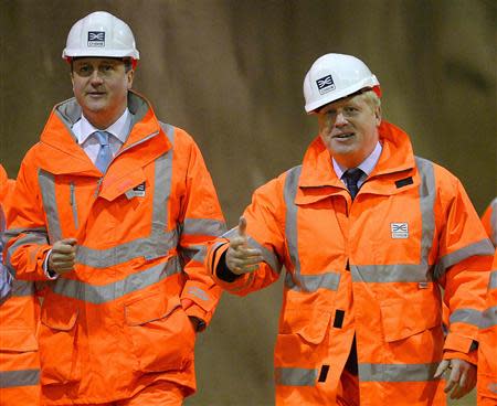 Britain's Prime Minister David Cameron (L) and London Mayor Boris Johnson visit a Crossrail construction site beneath Tottenham Court Road in central London January 16, 2014. REUTERS/Ben Stansall/pool