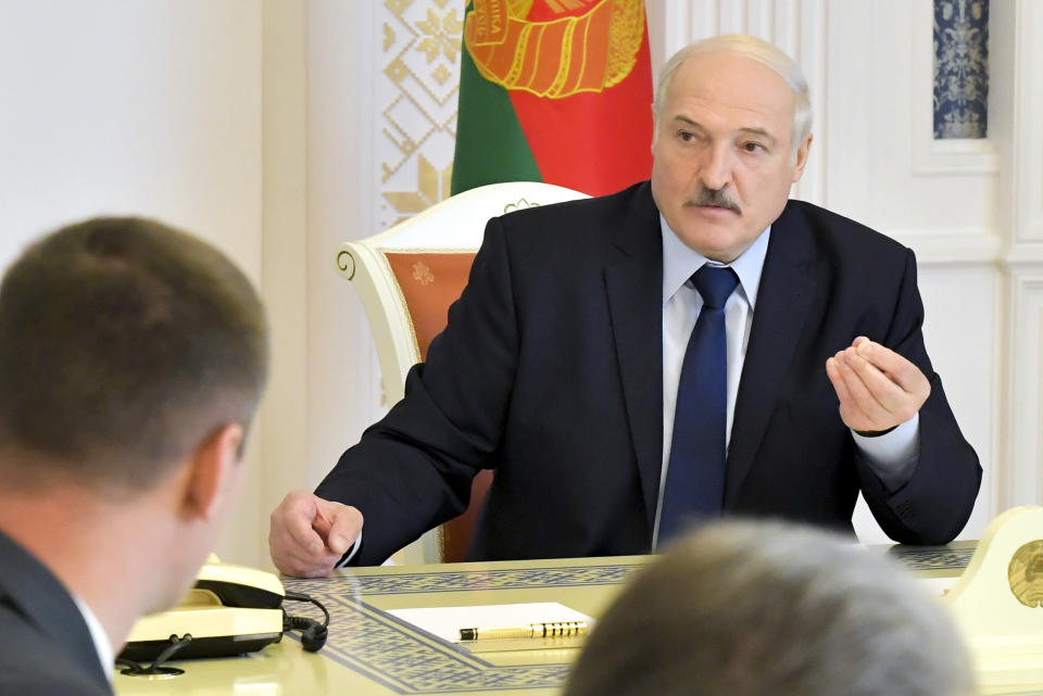 Belarusian President Alexander Lukashenko speaks at a meeting on issues of functioning and increasing the efficiency of the construction industry in Minsk, Belarus, Friday, Aug. 14, 2020. In five days of massive protests, crowds of demonstrators swarmed the streets to contest the vote results and demand an end to the 26-year rule of authoritarian President Alexander Lukashenko. Nearly 7,000 people have been detained and hundreds injured. (Andrei Stasevich/BelTA, Pool Photo via AP)