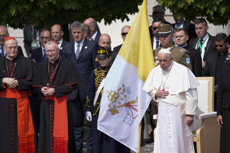 Pope Francis is welcomed by Hungarian authorities in the square of "Sándor" Palace in Budapest, Friday, April 28, 2023. The Pontiff is in Hungary for a three-day pastoral visit. (AP Photo/Darko Vojinovic)