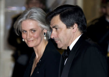 France's then Prime Minister Francois Fillon and his wife Penelope arrive for a state-official diner at the Elysee Palace in Paris March 10, 2008. REUTERS/Charles Platiau