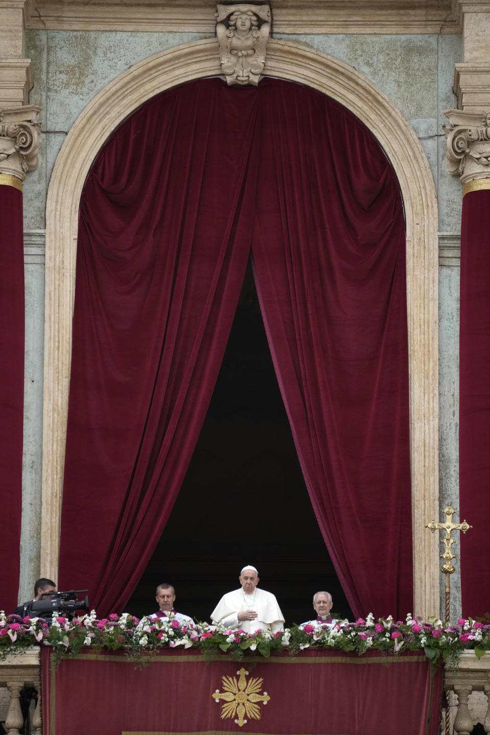 Pope Francis stands on the central lodge of the St. Peter's Basilica prior to the 'Urbi et Orbi' (To the city and to the world) blessing, at the Vatican, Sunday, March 31, 2024. (AP Photo/Andrew Medichini)