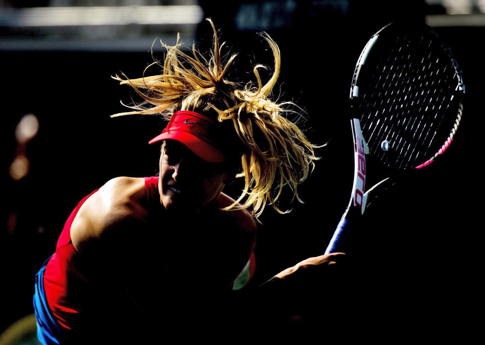 Eugenie Bouchard, of Canada, serves the ball while playing doubles with partner Karolina Pliskova, of the Czech Republic, against Anna-Lena Groenefeld, of Germany, and Kveta Peschke, of the Czech Republic, at the Rogers Cup tennis tournament in Toronto on Thursday, Aug. 10, 2017. (Nathan Denette/The Canadian Press via AP)