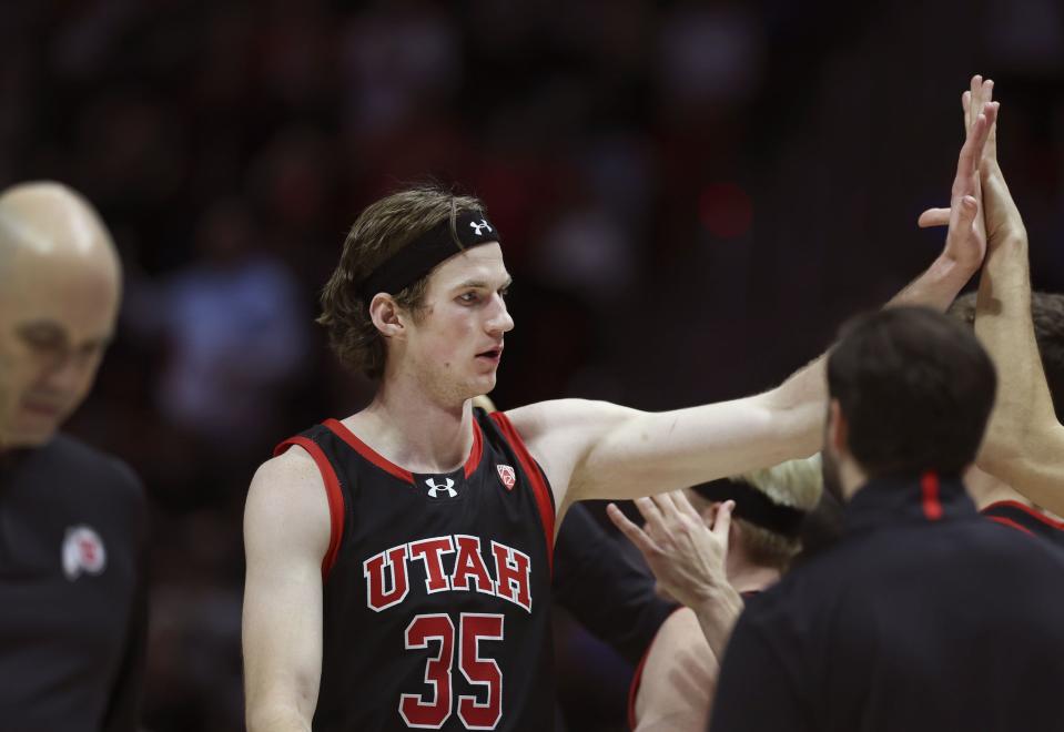 Utah Utes center Branden Carlson (35) is congratulated as he returns to the bench in the game against UCLA at the University of Utah’s Huntsman Center in Salt Lake City on Thursday, Jan. 11, 2024. | Laura Seitz, Deseret News